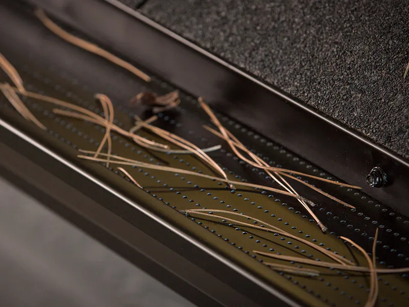 Professional gutter cleaning clearing leaves and debris